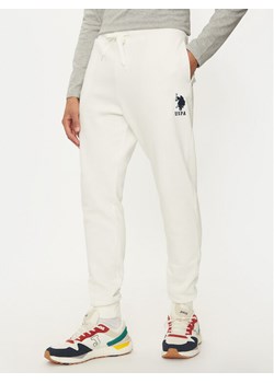 U.S. Polo Assn. Spodnie dresowe MUP0687 Écru Slim Fit ze sklepu MODIVO w kategorii Spodnie męskie - zdjęcie 182637338