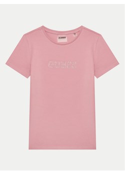 Guess T-Shirt J4RI49 J1314 Różowy Regular Fit ze sklepu MODIVO w kategorii Bluzki dziewczęce - zdjęcie 182637637