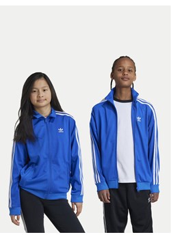 adidas Bluza Firebird IY9799 Niebieski Regular Fit ze sklepu MODIVO w kategorii Bluzy dziewczęce - zdjęcie 182643236