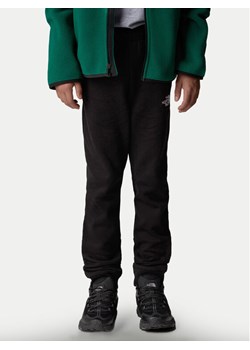 The North Face Spodnie dresowe NF0A89PD Czarny Regular Fit ze sklepu MODIVO w kategorii Spodnie chłopięce - zdjęcie 182643977