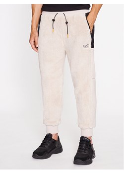 EA7 Emporio Armani Spodnie dresowe 6RPP82 PJSFZ 1716 Srebrny Regular Fit ze sklepu MODIVO w kategorii Spodnie męskie - zdjęcie 182645137