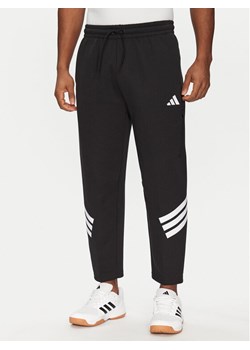 adidas Spodnie dresowe Future Icons 3-Stripes JD4889 Czarny Loose Fit ze sklepu MODIVO w kategorii Spodnie męskie - zdjęcie 182646019