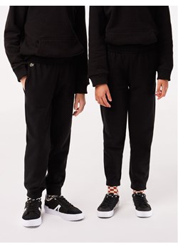Lacoste Spodnie dresowe XJ9728 Czarny Regular Fit ze sklepu MODIVO w kategorii Spodnie chłopięce - zdjęcie 182647656