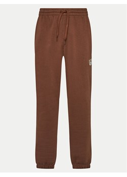 Reebok Spodnie dresowe Cl Ae Pant 100202799 Brązowy Regular Fit ze sklepu MODIVO w kategorii Spodnie damskie - zdjęcie 182647657