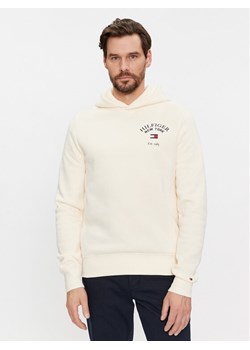 Tommy Hilfiger Bluza Arched Varsity MW0MW33641 Beżowy Regular Fit ze sklepu MODIVO w kategorii Bluzy męskie - zdjęcie 182650886