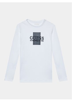 Guess Bluzka L3BI10 I3Z14 Biały Regular Fit ze sklepu MODIVO w kategorii T-shirty chłopięce - zdjęcie 182651817
