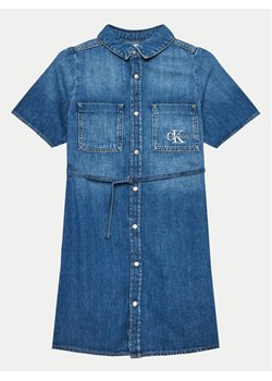 Calvin Klein Jeans Sukienka jeansowa IG0IG02578 Niebieski Regular Fit ze sklepu MODIVO w kategorii Sukienki dziewczęce - zdjęcie 182653708