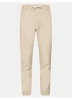 s.Oliver Spodnie materiałowe 2143826 Beżowy Slim Fit ze sklepu MODIVO w kategorii Spodnie męskie - zdjęcie 182653775