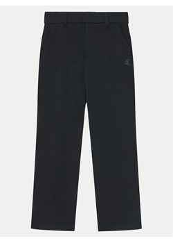 Calvin Klein Jeans Spodnie materiałowe IB0IB02341 Czarny Slim Fit ze sklepu MODIVO w kategorii Spodnie dziewczęce - zdjęcie 182654799