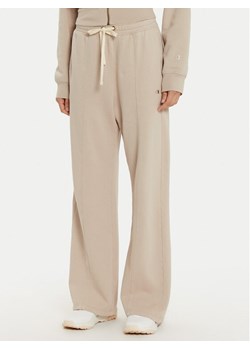 Champion Spodnie dresowe 117638 Beżowy Wide Leg ze sklepu MODIVO w kategorii Spodnie damskie - zdjęcie 182655135
