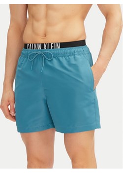 Calvin Klein Swimwear Szorty kąpielowe KM0KM01093 Niebieski Regular Fit ze sklepu MODIVO w kategorii Kąpielówki - zdjęcie 182655597