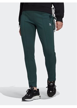 adidas Spodnie dresowe Always Original Laced HK5083 Zielony Slim Fit ze sklepu MODIVO w kategorii Spodnie damskie - zdjęcie 182656828