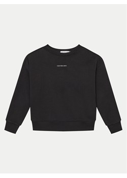 Calvin Klein Jeans Bluza Monogram IB0IB02258 Czarny Regular Fit ze sklepu MODIVO w kategorii Bluzy chłopięce - zdjęcie 182656887