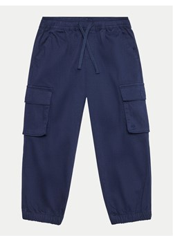 United Colors Of Benetton Joggery 4HM6GF01Z Granatowy Regular Fit ze sklepu MODIVO w kategorii Spodnie chłopięce - zdjęcie 182658638