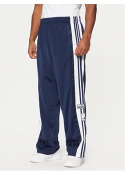 adidas Spodnie dresowe Adibreak JD4268 Granatowy Loose Fit ze sklepu MODIVO w kategorii Spodnie męskie - zdjęcie 182660776