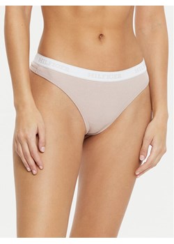 Tommy Hilfiger Stringi UW0UW05539 Beżowy ze sklepu MODIVO w kategorii Majtki damskie - zdjęcie 182665195