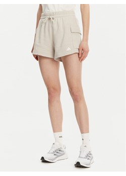 adidas Szorty sportowe Essentials Small Logo JC5699 Beżowy Loose Fit ze sklepu MODIVO w kategorii Szorty - zdjęcie 182666365