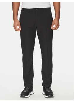 BOSS Spodnie materiałowe T_Commuter 50534303 Czarny Slim Fit ze sklepu MODIVO w kategorii Spodnie męskie - zdjęcie 182669745