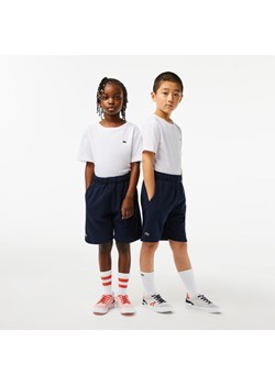 Lacoste Szorty sportowe GJ9733 Granatowy Regular Fit ze sklepu MODIVO w kategorii Spodenki chłopięce - zdjęcie 182671846