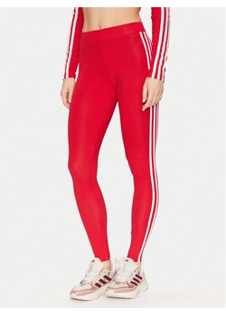 adidas Legginsy Adicolor Classics 3-Stripes Leggings IB7382 Czerwony ze sklepu MODIVO w kategorii Spodnie damskie - zdjęcie 182673646