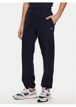Champion Spodnie dresowe 220709 Granatowy Relaxed Fit ze sklepu MODIVO w kategorii Spodnie męskie - zdjęcie 182673727
