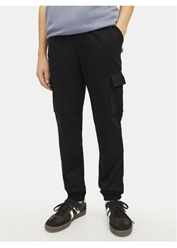 Jack&Jones Junior Spodnie dresowe Gordon 12254214 Czarny Slim Fit ze sklepu MODIVO w kategorii Spodnie chłopięce - zdjęcie 182675145