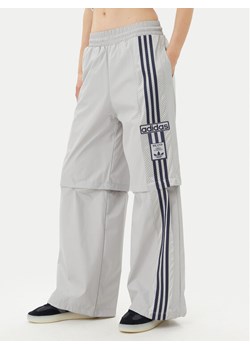 adidas Spodnie dresowe Adibreak JJ3122 Szary Regular Fit ze sklepu MODIVO w kategorii Spodnie damskie - zdjęcie 182675768