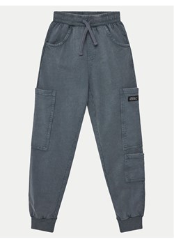 Coccodrillo Spodnie dresowe WC5120103SBJ Szary Slim Fit ze sklepu MODIVO w kategorii Spodnie chłopięce - zdjęcie 182676429