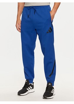 adidas Spodnie dresowe Z.N.E. JF6541 Niebieski Regular Fit ze sklepu MODIVO w kategorii Spodnie męskie - zdjęcie 182678149