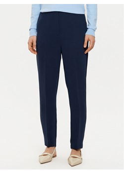 Tommy Hilfiger Chinosy WW0WW45450 Granatowy Slim Fit ze sklepu MODIVO w kategorii Spodnie damskie - zdjęcie 182678306