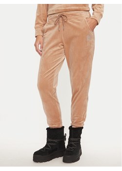 DKNY Spodnie dresowe DP4P3535 Beżowy Regular Fit ze sklepu MODIVO w kategorii Spodnie damskie - zdjęcie 182678776