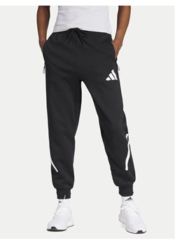 adidas Spodnie dresowe Z.N.E. JC9309 Czarny Regular Fit ze sklepu MODIVO w kategorii Spodnie damskie - zdjęcie 182679366