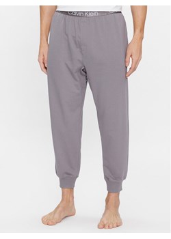 Calvin Klein Underwear Spodnie piżamowe 000NM2175E Szary Regular Fit ze sklepu MODIVO w kategorii Piżamy męskie - zdjęcie 182680028