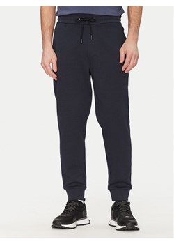 Boss Spodnie dresowe C-Locsin 01 50520322 Granatowy Regular Fit ze sklepu MODIVO w kategorii Spodnie męskie - zdjęcie 182680669