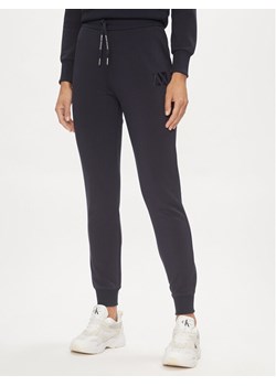 Armani Exchange Spodnie dresowe 3DYP79 YJEPZ 1593 Granatowy Regular Fit ze sklepu MODIVO w kategorii Spodnie damskie - zdjęcie 182684998