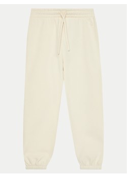 United Colors Of Benetton Spodnie dresowe 39M2CF05I Beżowy Regular Fit - id: 0000304521409 - marki United Colors Of Benetton - 182685078 United Colors Of Benetton Spodnie dresowe 39M2CF05I Beżowy Regular Fit ze sklepu MODIVO w kategorii Spodnie dziewczęce - zdjęcie 182685078