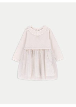 Coccodrillo Sukienka dzianinowa ZC4129402EBG Écru Regular Fit ze sklepu MODIVO w kategorii Sukienki niemowlęce - zdjęcie 182685235