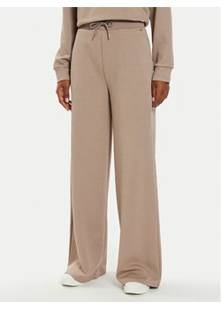 Guess Spodnie palazzo Peony V4BB02 KCHR2 Beżowy Relaxed Fit ze sklepu MODIVO w kategorii Spodnie damskie - zdjęcie 182686587