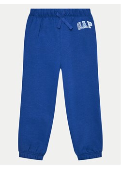 Gap Spodnie dresowe 609724-02 Niebieski Relaxed Fit ze sklepu MODIVO w kategorii Spodnie chłopięce - zdjęcie 182686908