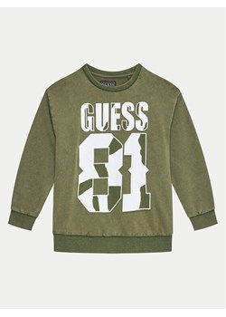Guess Bluza L4YQ08 KA6R4 Zielony Regular Fit ze sklepu MODIVO w kategorii Bluzy chłopięce - zdjęcie 182687809