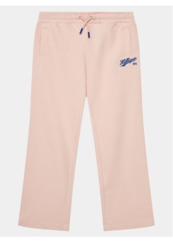 Tommy Hilfiger Spodnie dresowe Hilfiger Script Wide Sweatpant KG0KG07751 Różowy Regular Fit ze sklepu MODIVO w kategorii Spodnie dziewczęce - zdjęcie 182689228