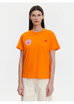 adidas T-Shirt FARM Graphic JD6293 Pomarańczowy Regular Fit ze sklepu MODIVO w kategorii Bluzki damskie - zdjęcie 182689455