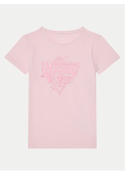 Guess T-Shirt J5RI02 K6YW4 Różowy Regular Fit ze sklepu MODIVO w kategorii Bluzki dziewczęce - zdjęcie 182694138