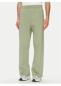 Karl Kani Spodnie dresowe Ellipse Straight Leg 60060043 Khaki Relaxed Fit ze sklepu MODIVO w kategorii Spodnie męskie - zdjęcie 182694699