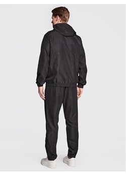 Lacoste Komplet kurtka i spodnie WH2661 Czarny Regular Fit ze sklepu MODIVO w kategorii Spodnie męskie - zdjęcie 182696927