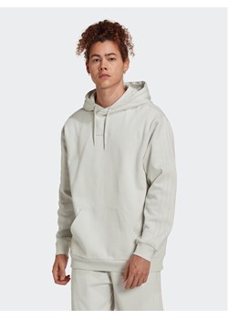 adidas Bluza Reveal Ess HK2725 Beżowy Loose Fit ze sklepu MODIVO w kategorii Bluzy męskie - zdjęcie 182697418