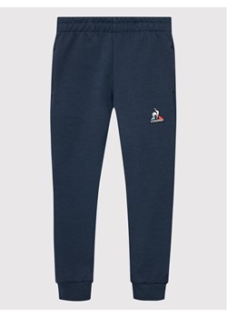 Le Coq Sportif Spodnie dresowe 2210488 Granatowy Regular Fit ze sklepu MODIVO w kategorii Spodnie chłopięce - zdjęcie 182698116