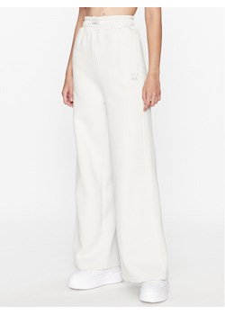 Puma Spodnie dresowe Infuse 621448 Szary Wide Leg ze sklepu MODIVO w kategorii Spodnie męskie - zdjęcie 182701169