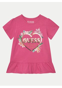 Guess T-Shirt K5GI10 K6YW Różowy Regular Fit ze sklepu MODIVO w kategorii Bluzki dziewczęce - zdjęcie 182701356