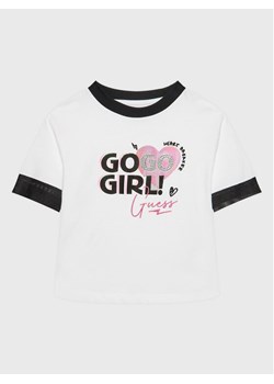 Guess T-Shirt J3RI08 KB7T0 Biały Regular Fit ze sklepu MODIVO w kategorii Bluzki dziewczęce - zdjęcie 182706195